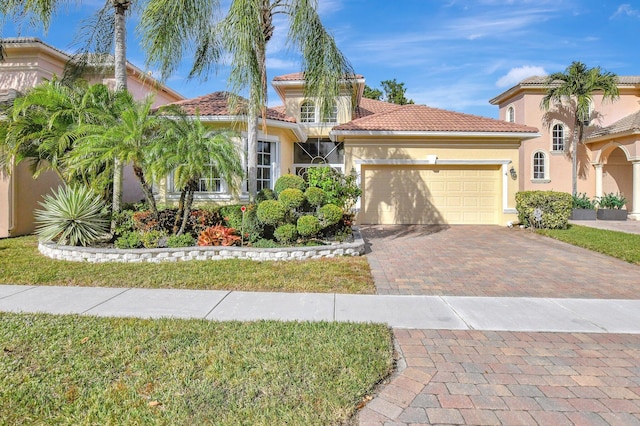 mediterranean / spanish-style house featuring a garage