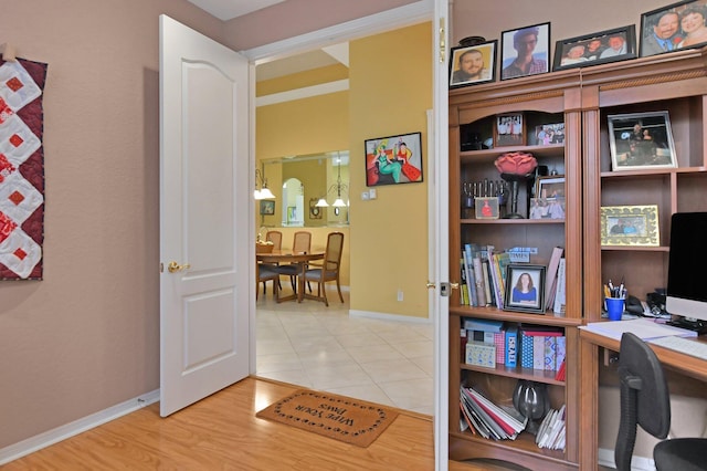 office area with light hardwood / wood-style flooring