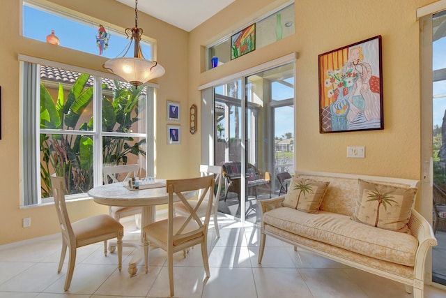 dining space with light tile patterned flooring