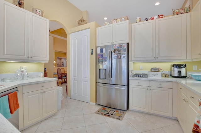 kitchen featuring white cabinets, light tile patterned floors, and appliances with stainless steel finishes