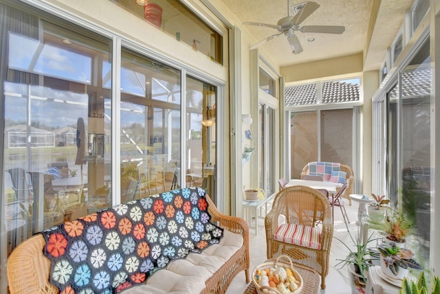 sunroom featuring ceiling fan