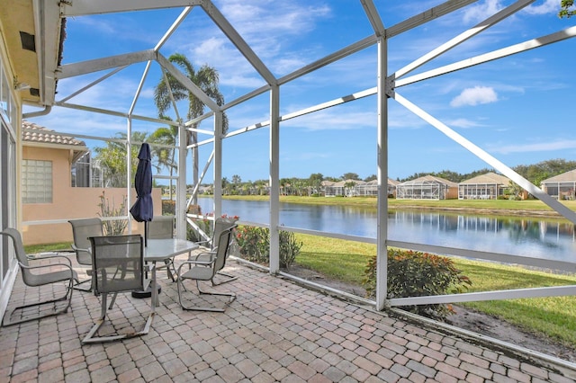 unfurnished sunroom with a water view