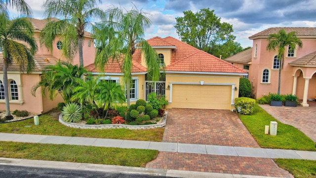 mediterranean / spanish-style home featuring a garage