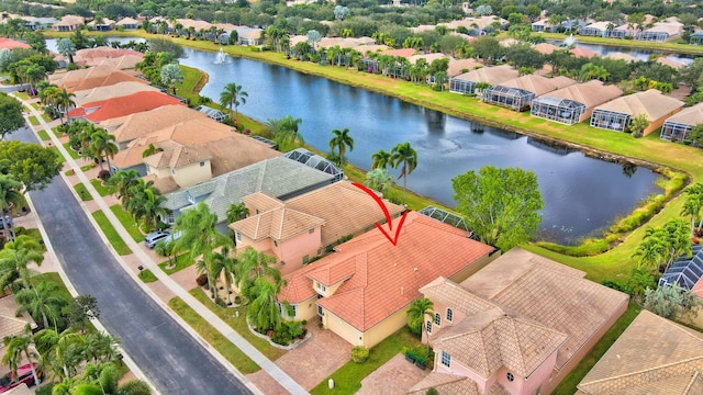 birds eye view of property with a water view