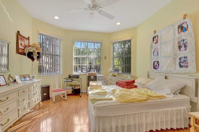 bedroom with light hardwood / wood-style flooring and ceiling fan