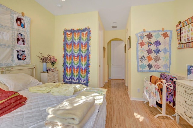 bedroom with light hardwood / wood-style floors