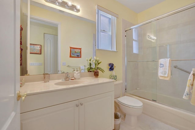 full bathroom featuring vanity, toilet, and enclosed tub / shower combo