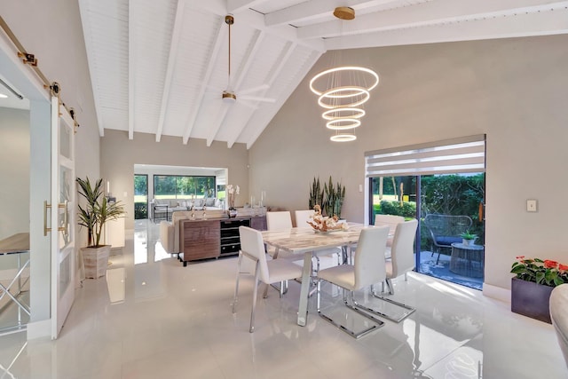 dining area featuring high vaulted ceiling, a barn door, beam ceiling, light tile patterned flooring, and a chandelier