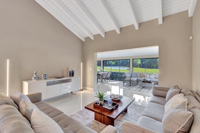 living room featuring beam ceiling and high vaulted ceiling