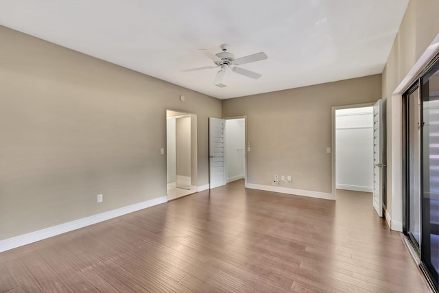 unfurnished bedroom featuring hardwood / wood-style flooring and ceiling fan