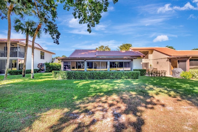 back of house with a yard