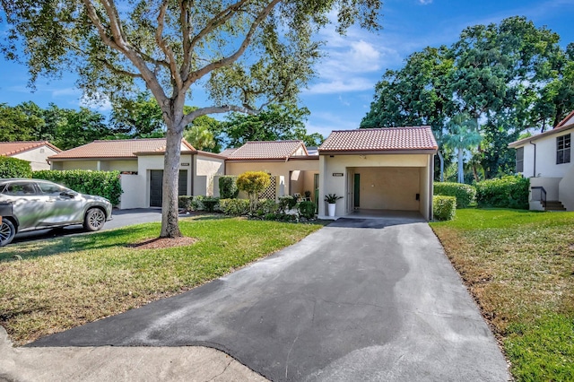 mediterranean / spanish-style house featuring a front lawn