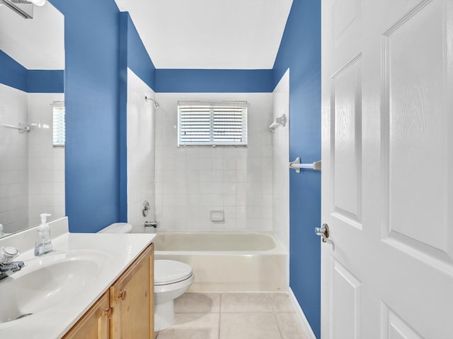 full bathroom featuring tile patterned flooring, lofted ceiling, toilet, vanity, and tiled shower / bath