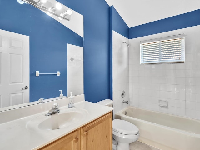 full bathroom featuring tile patterned floors, toilet, vanity, and tiled shower / bath