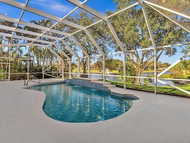 view of pool featuring a lanai, a patio area, pool water feature, and a water view