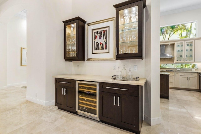 bar featuring decorative backsplash, ornamental molding, beverage cooler, wall chimney range hood, and dishwasher