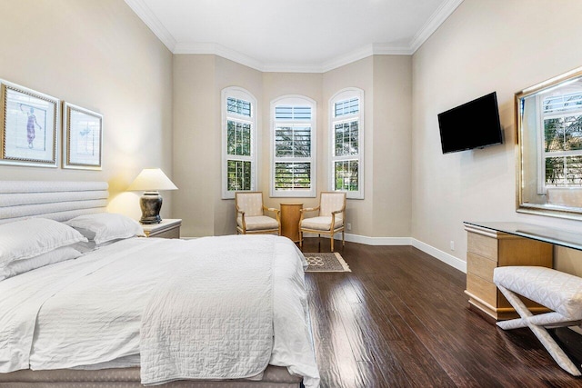 bedroom with dark hardwood / wood-style floors, multiple windows, and ornamental molding