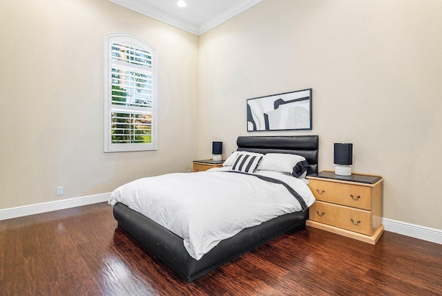 bedroom featuring dark hardwood / wood-style floors and crown molding