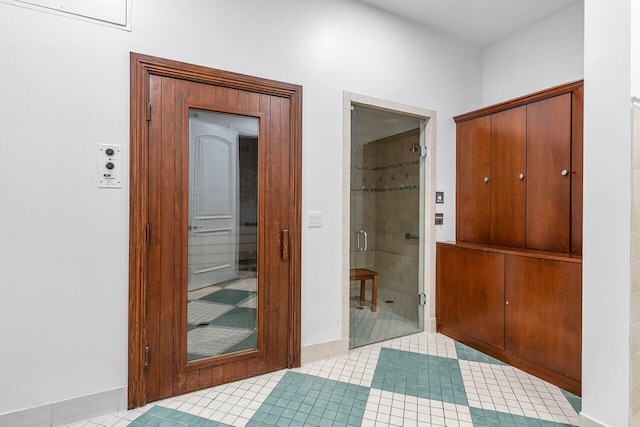 corridor featuring light tile patterned flooring