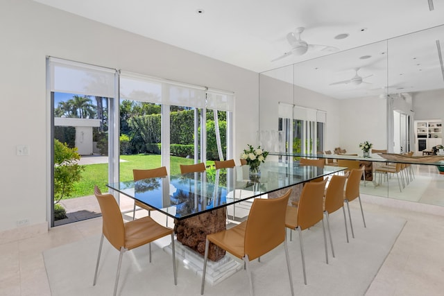 dining area with light tile patterned floors and ceiling fan