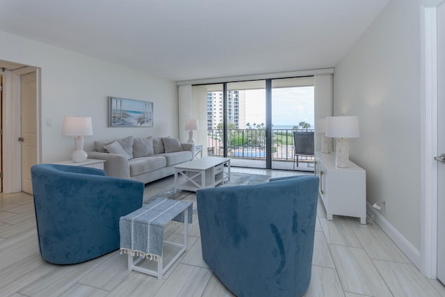 living room featuring floor to ceiling windows