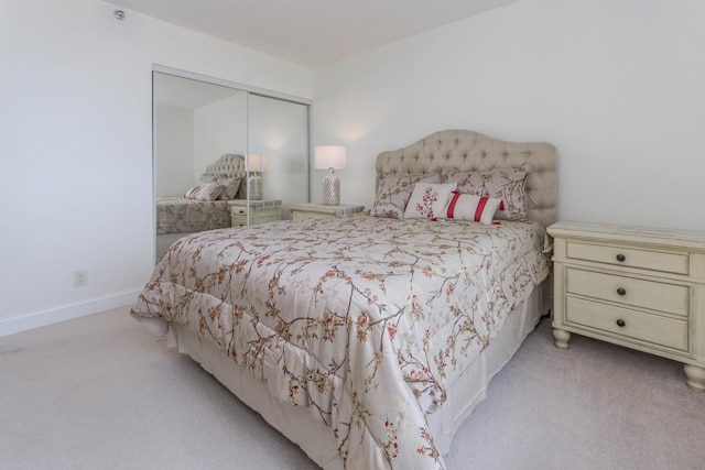 carpeted bedroom featuring a closet