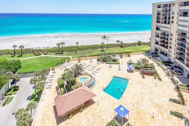 exterior space featuring a view of the beach and a water view