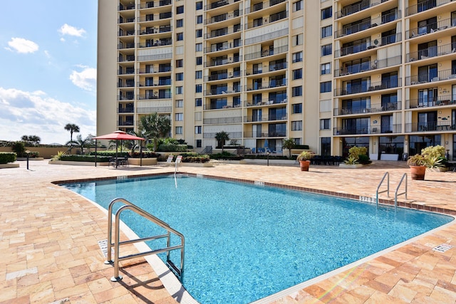 view of swimming pool with a patio