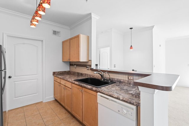 kitchen featuring dishwasher, decorative light fixtures, kitchen peninsula, and sink