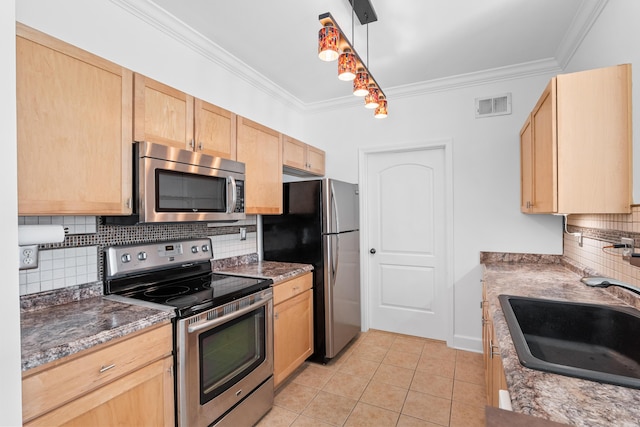 kitchen featuring light brown cabinetry, stainless steel appliances, light tile patterned floors, and sink