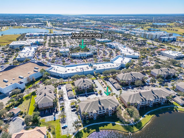 drone / aerial view with a water view