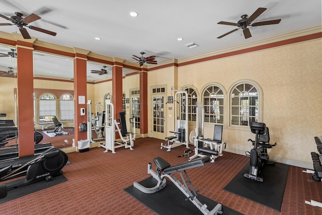 workout area featuring carpet flooring and ornamental molding