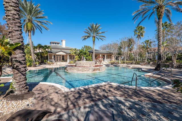 view of pool with a jacuzzi