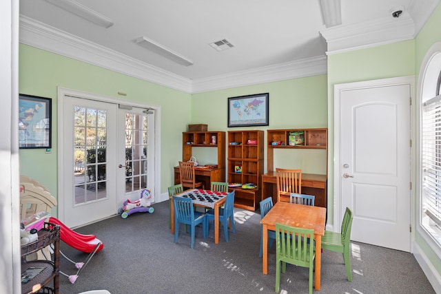 rec room featuring dark colored carpet, french doors, and ornamental molding