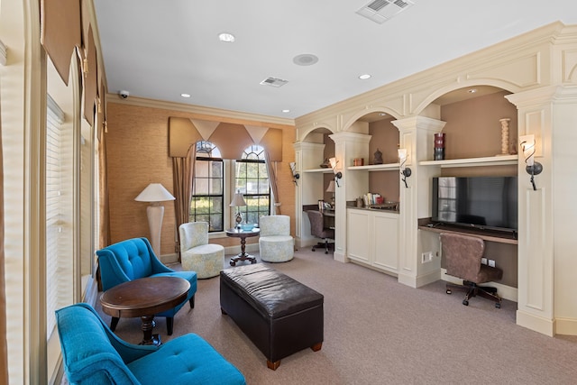 living area featuring crown molding and light carpet