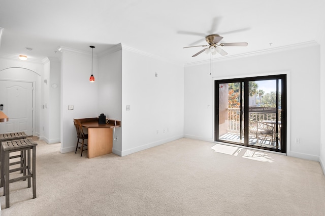 carpeted living room featuring ceiling fan and ornamental molding