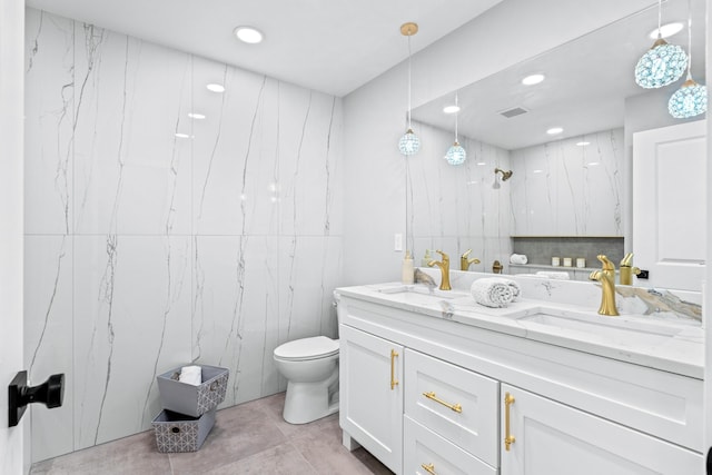 bathroom with a shower, tile patterned floors, vanity, and toilet