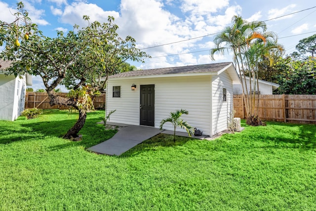 view of outbuilding featuring a lawn