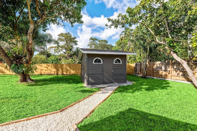 view of outbuilding featuring a lawn