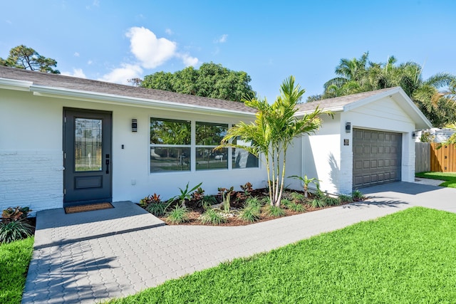 single story home with a garage