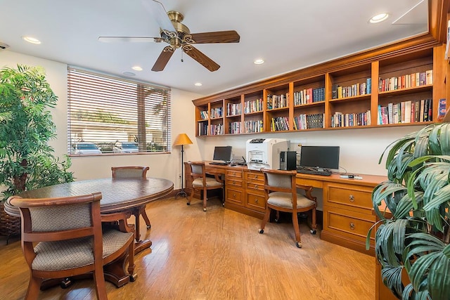 office area with ceiling fan and light hardwood / wood-style floors