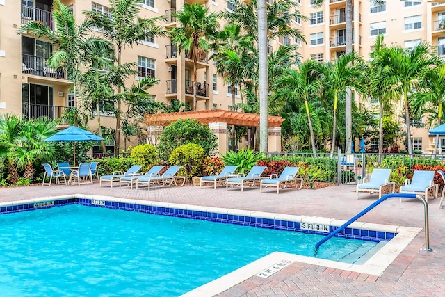 view of swimming pool with a pergola