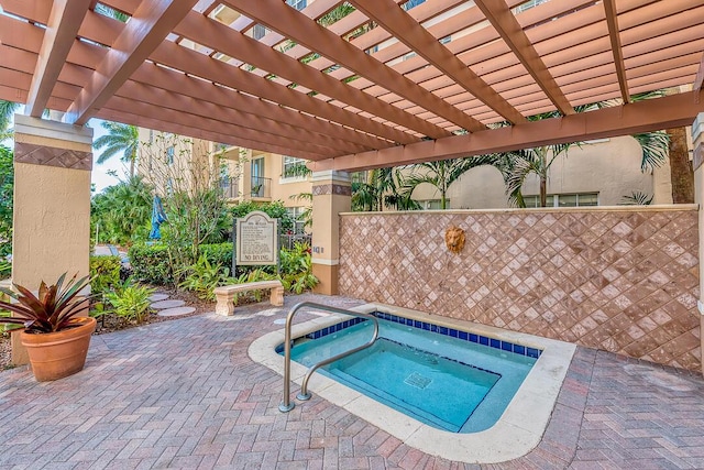 view of swimming pool featuring a pergola, a patio area, and a hot tub