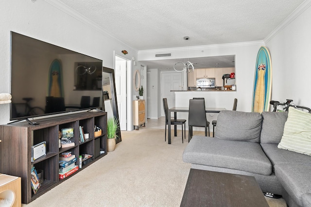 living room featuring light carpet, a textured ceiling, and ornamental molding