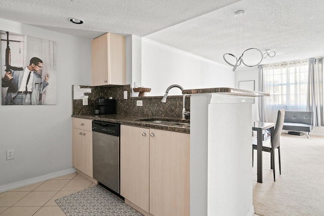 kitchen with crown molding, sink, stainless steel dishwasher, light tile patterned floors, and a textured ceiling