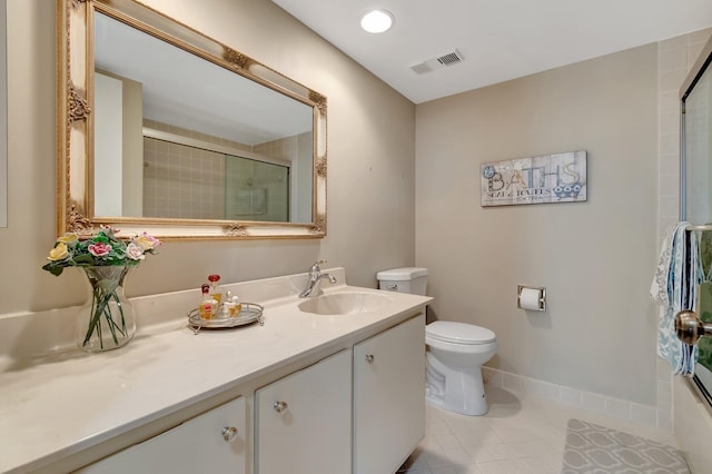 full bathroom with tile patterned floors, vanity, enclosed tub / shower combo, and toilet