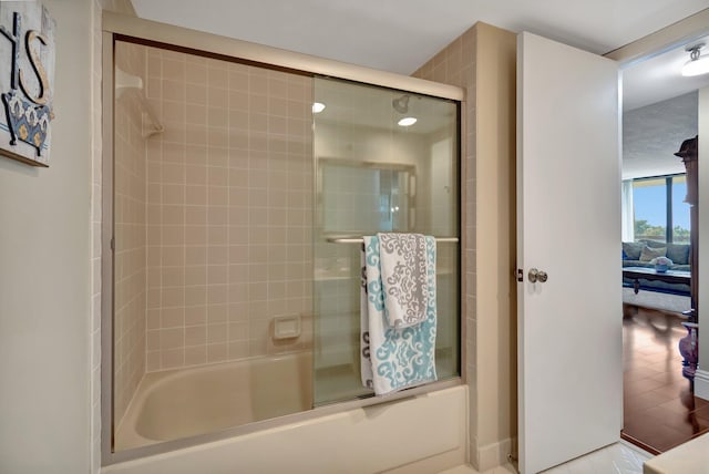 bathroom with tile patterned floors and enclosed tub / shower combo