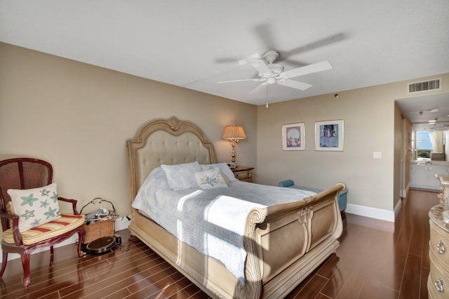 bedroom featuring ceiling fan and dark hardwood / wood-style floors