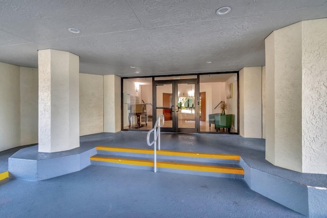 entrance to property featuring french doors