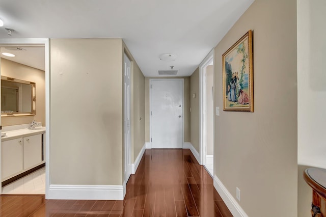 hall featuring dark wood-type flooring